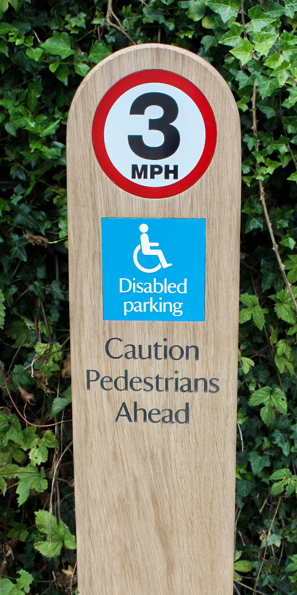 Wooden Monolith Sign Post with speed limit warning symbol and rounded top