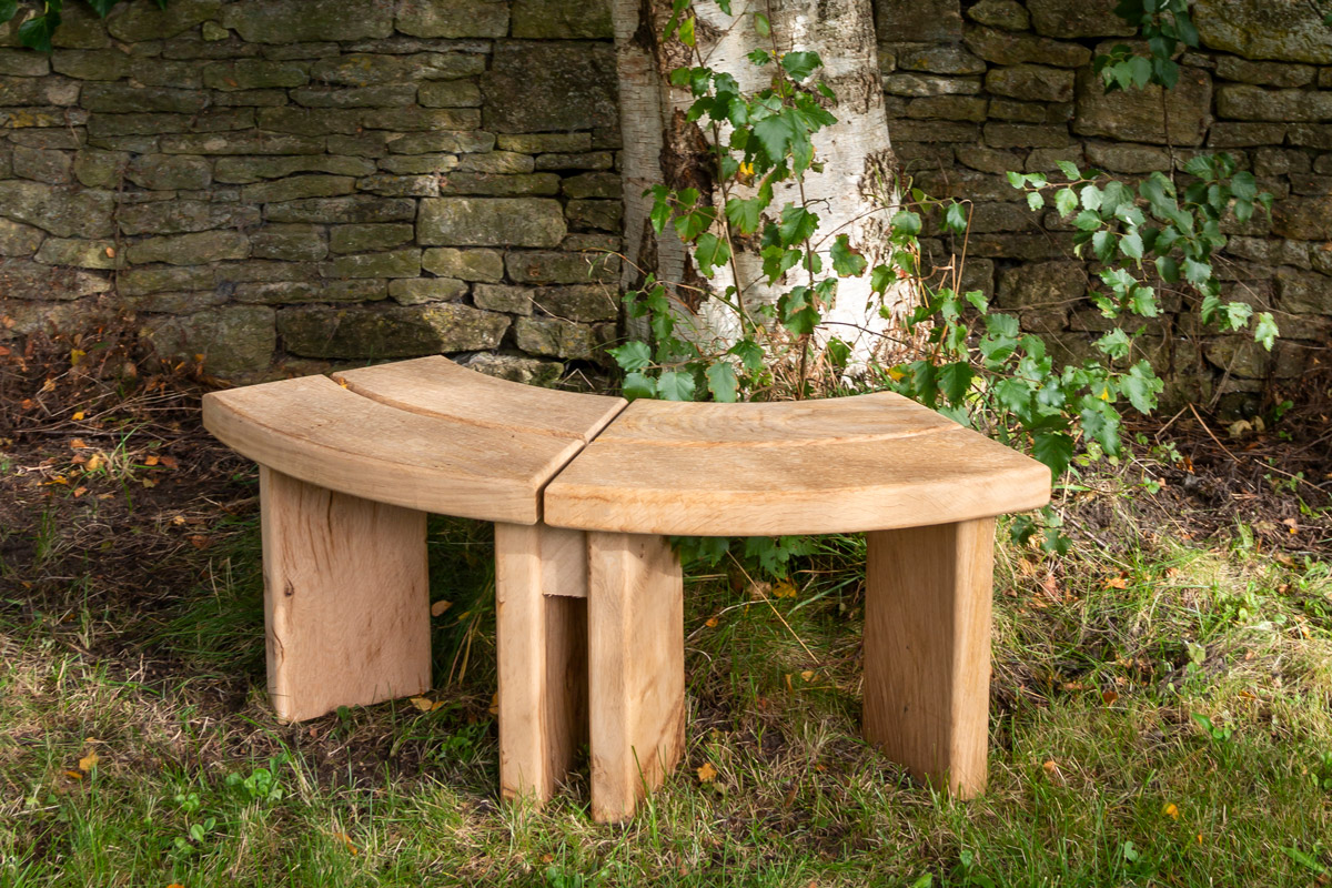 Curved oak bench made from kiln-dried English oak.